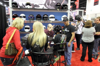 Child getting helmet fitted in Simpson booth