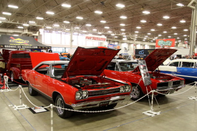 A set red Plymouth GTX and Dodge Charger vehicles