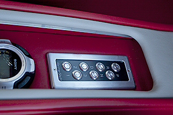 Push button shifter behind the sliding console door